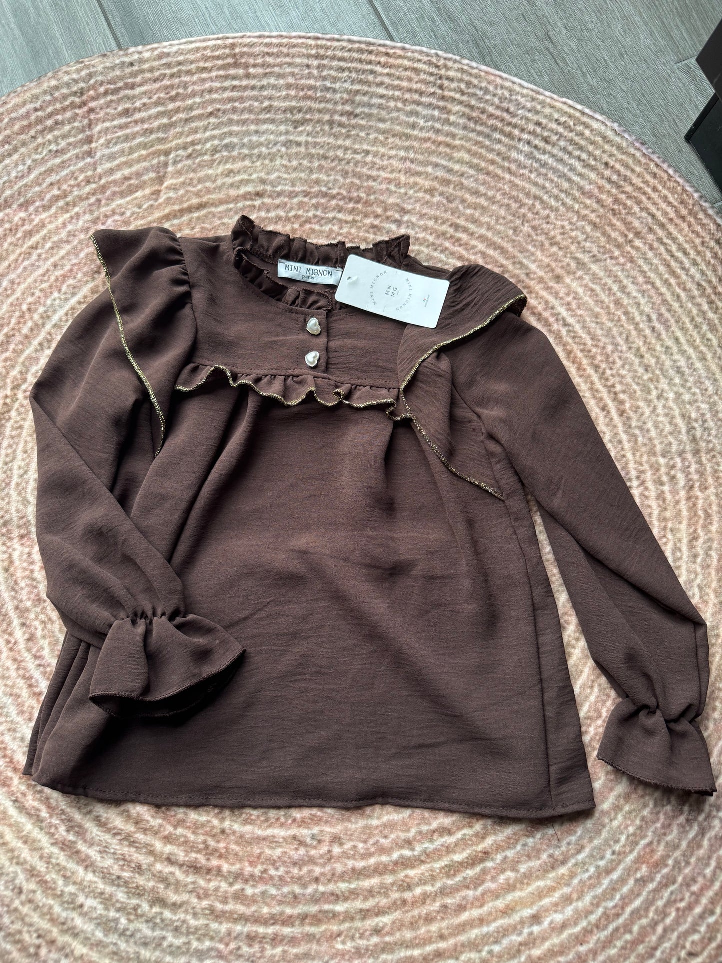 Meisjes blouse met gouden rand en hartjesknoop